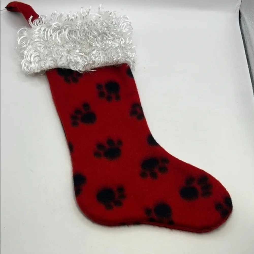 Red Christmas Stocking with Black Paw Prints.